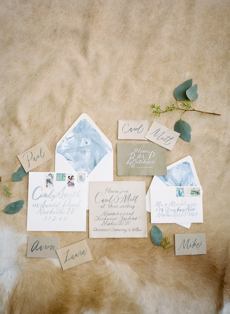 Beautiful wedding invitation suite with blue watercolor, and natural tones and blue calligraphy 