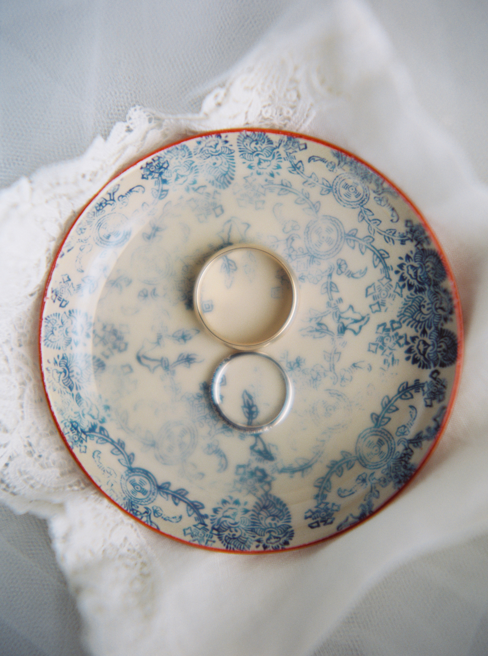 rings in a blue and copper ring dish detail with a lace vintage handkerchief and tulle