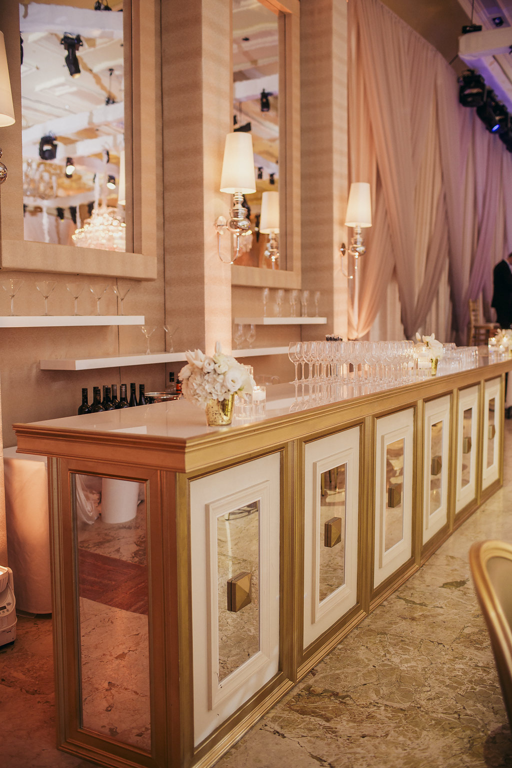 Mirrored bar station set up in a lavish ballroom